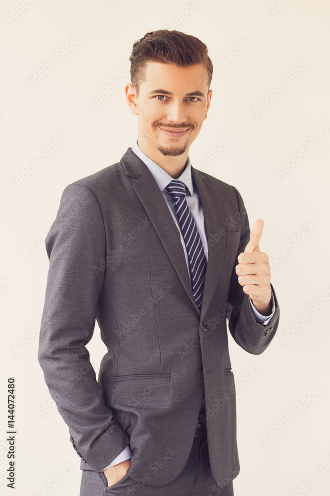 Fotografie Successful Elegant Business Man Showing Thumb Up