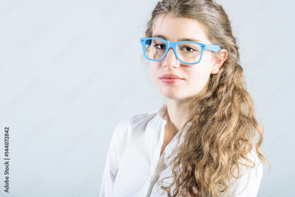 Cute young successful woman in glasses, female boss. Cute young successful woman in glasses, female boss.