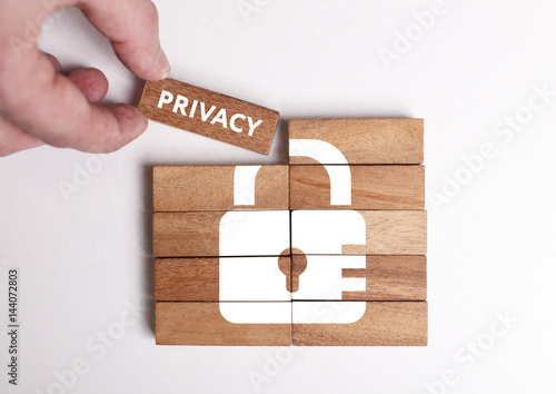 Business, Technology, Internet and network concept. Young businessman shows the word: Privacy photo
