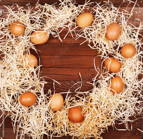 Eggs on wooden background photo