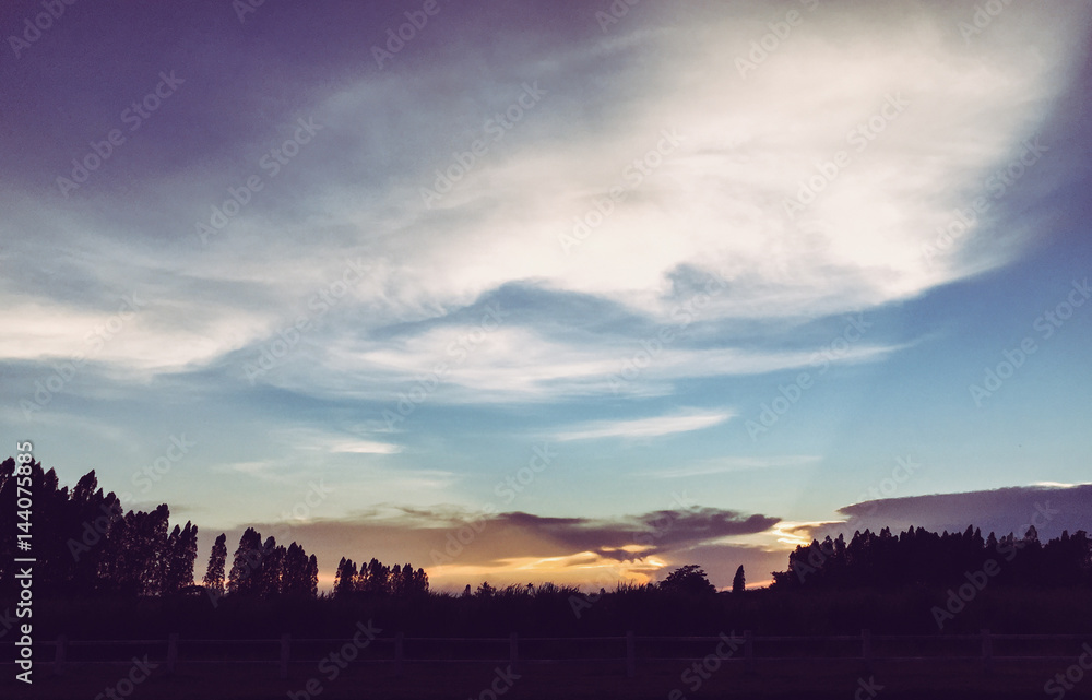 Fototapeta premium sky with partly cloudy at dusk, Sunset with sun rays