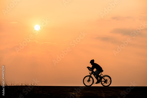 Wallpaper Mural Silhouette of cyclist on sunset background Torontodigital.ca