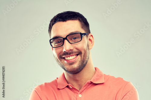 portrait of happy smiling man in eyeglasses © Syda Productions