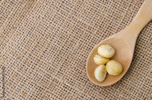macadamia nuts in a wood spoon