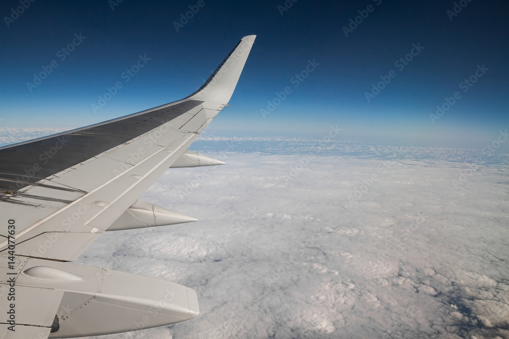 Obraz premium view from the airplane window to the clouds