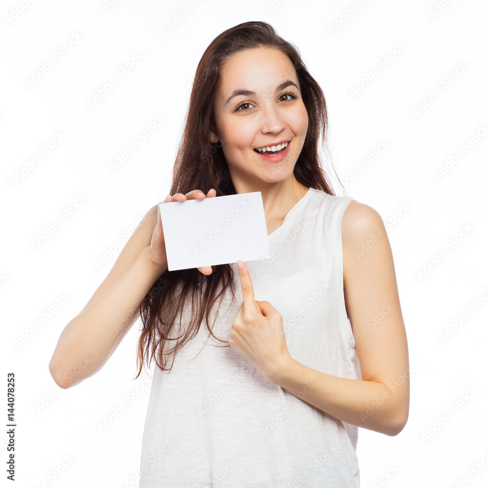Cheerful woman pointing at a blank business card Cheerful woman pointing at a blank business card