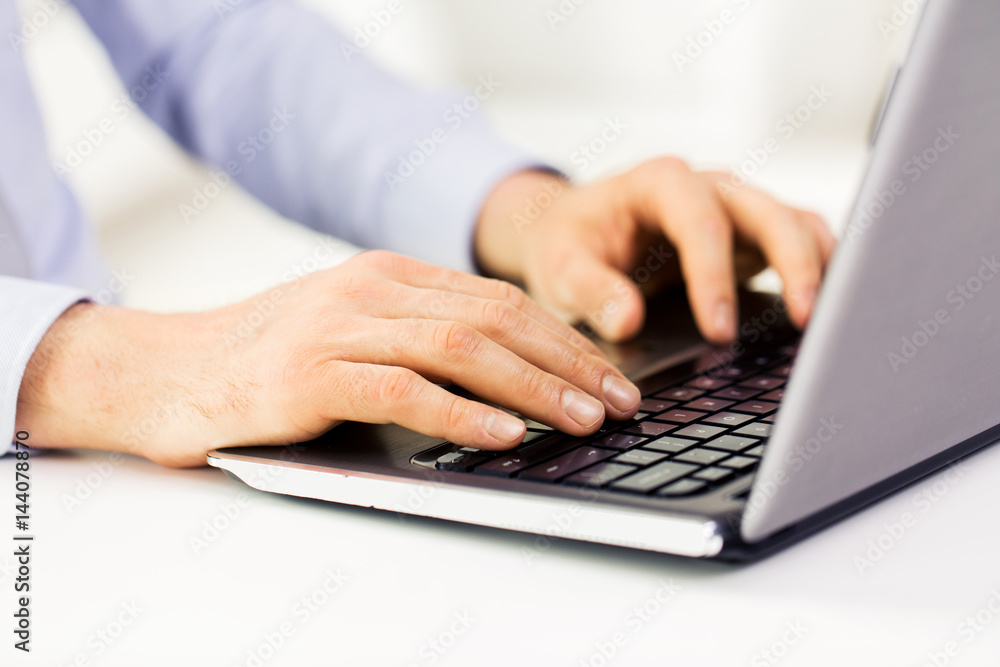 close up of male hands with laptop typing close up of male hands with laptop typing