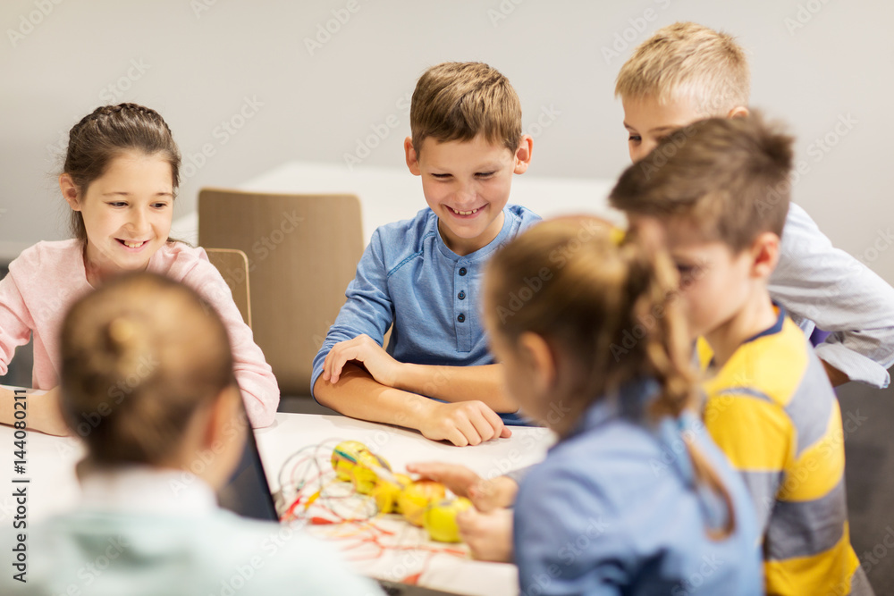 happy children building robots at robotics school happy children building robots at robotics school