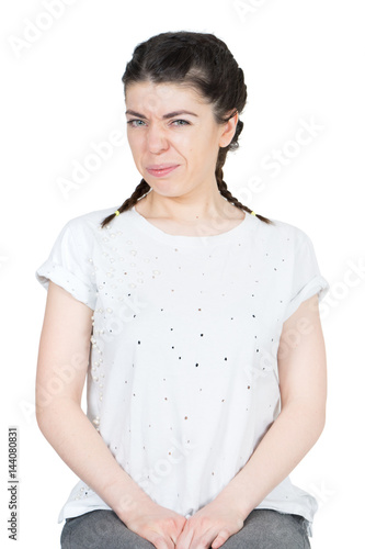 Fotografi Woman in a white t-shirt feeling disgust