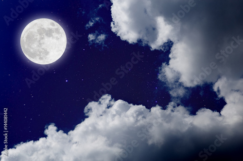 Fototapeta Naklejka Na Ścianę i Meble -  Romantic night with full moon in space over stars with cloudscape background. wonderful night.