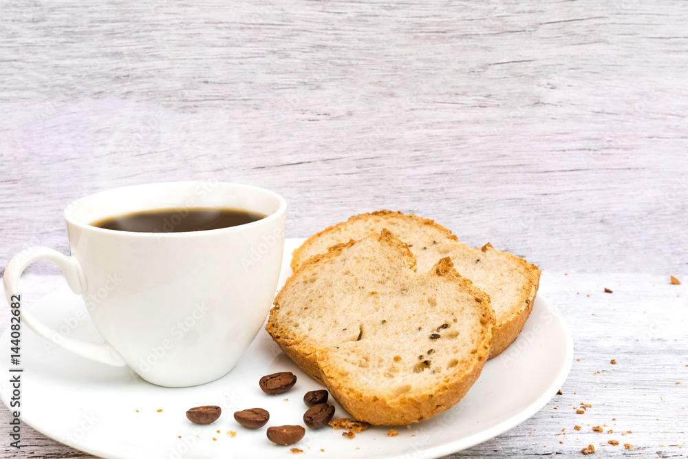 hot coffee with fresh bread on the white table for breakfast hot coffee with fresh bread on the white table for breakfast
