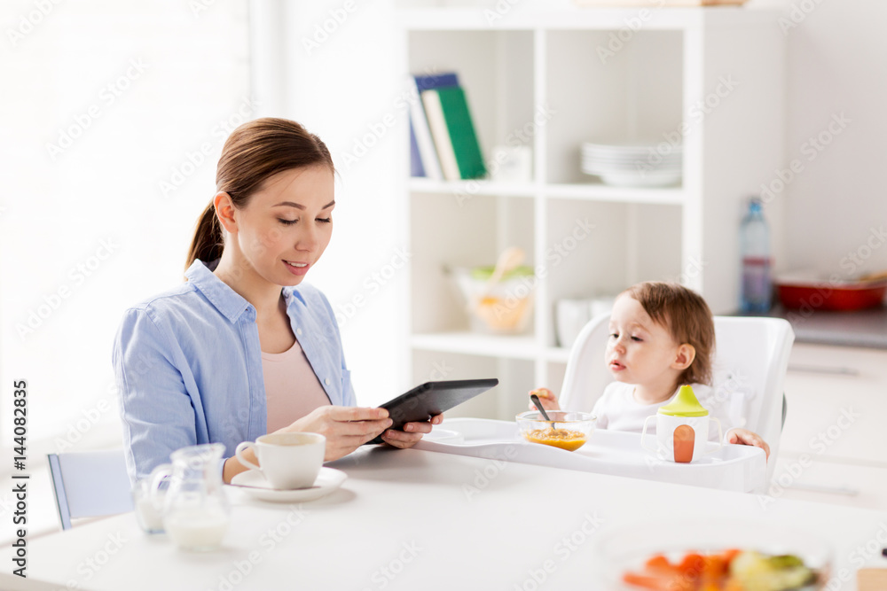 happy mother and baby having breakfast at home happy mother and baby having breakfast at home