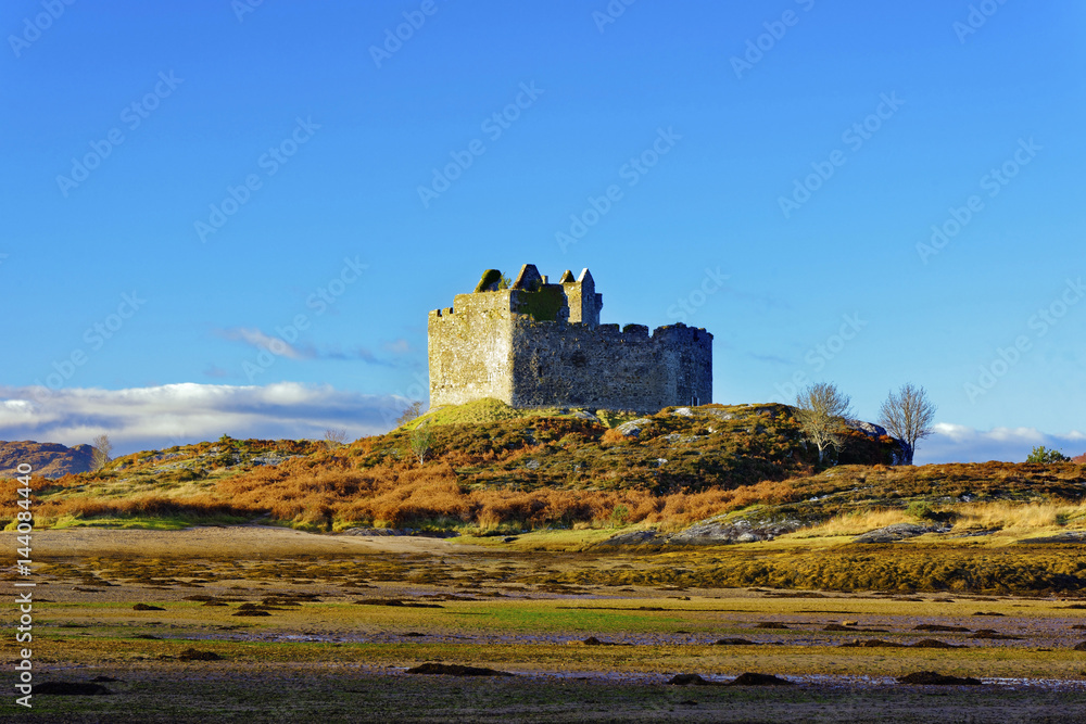 Castle Tioram on the coastal island Eilean Tioram where River Shiel and Loch Moidart meet, at low tide on a sunny winter morning, Highlands, Scotland Castle Tioram on the coastal island Eilean Tioram where River Shiel and Loch Moidart meet, at low tide on a sunny winter morning, Highlands, Scotland