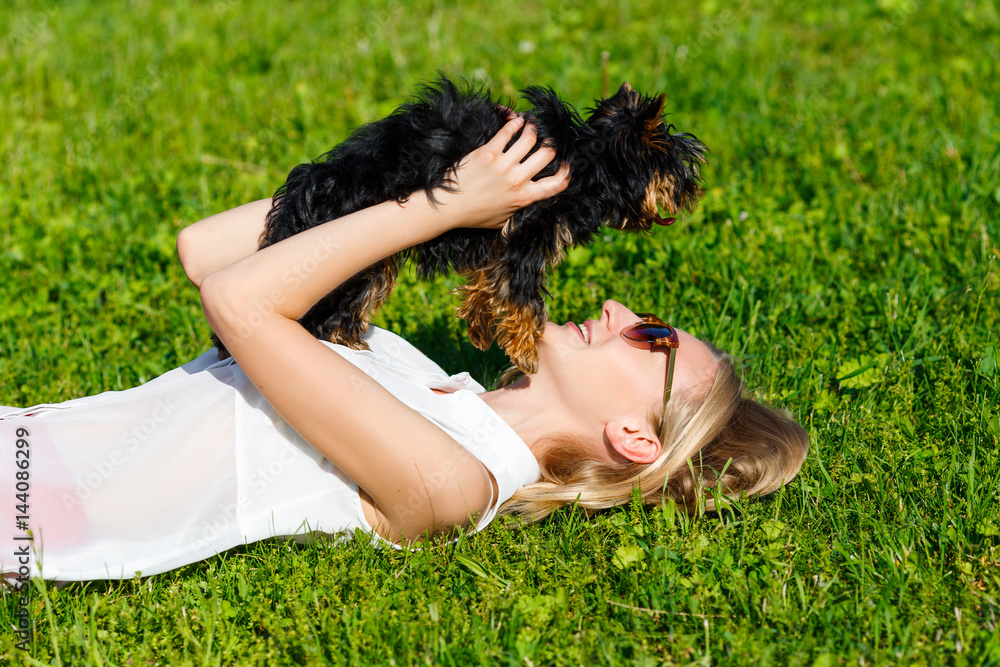 Dog and his owner - Cool dog and young women having fun in a par Dog and his owner - Cool dog and young women having fun in a par