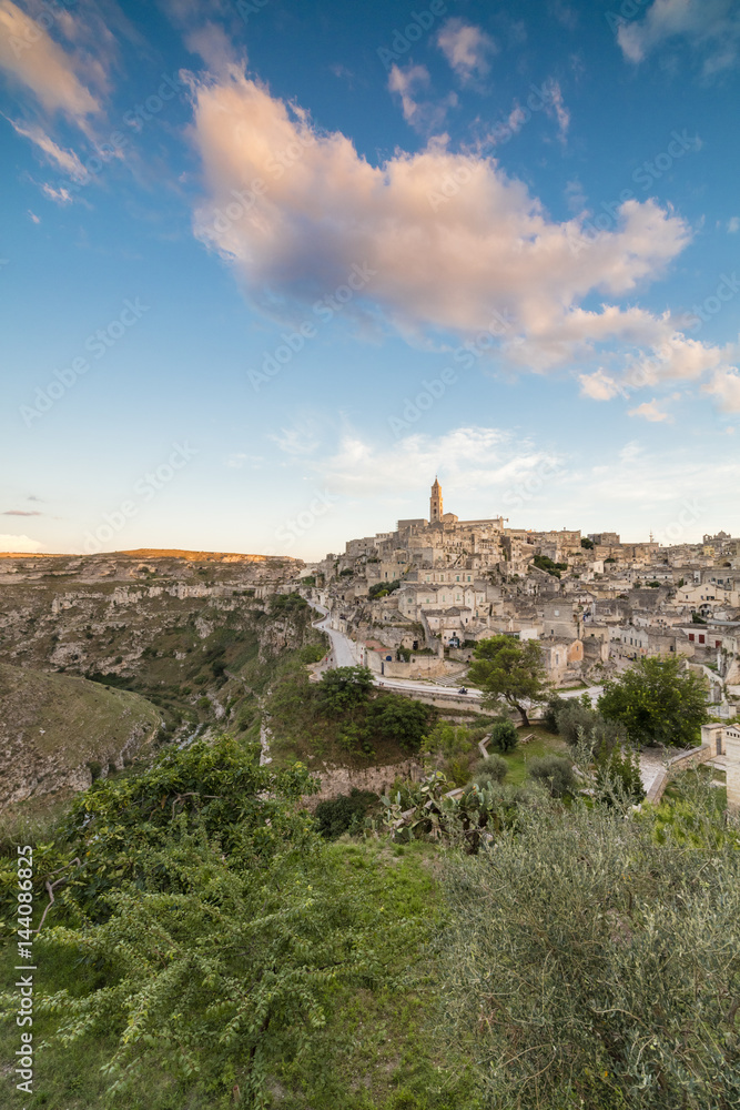 Sunset on the ancient town and historical center called Sassi, perched on rocks on top of hill, Matera, Basilicata Sunset on the ancient town and historical center called Sassi, perched on rocks on top of hill, Matera, Basilicata