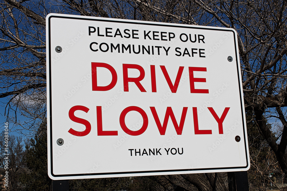 Drive slowly sign in a community area
