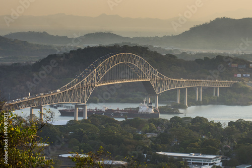 Cargo boat passes the Bridge of the Americas on the Panama Canal, Panama City, Panama