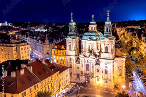 The Church of Saint Nicholas in the Old Town of Prague. View from Old Town Hall at night. Czech Republic