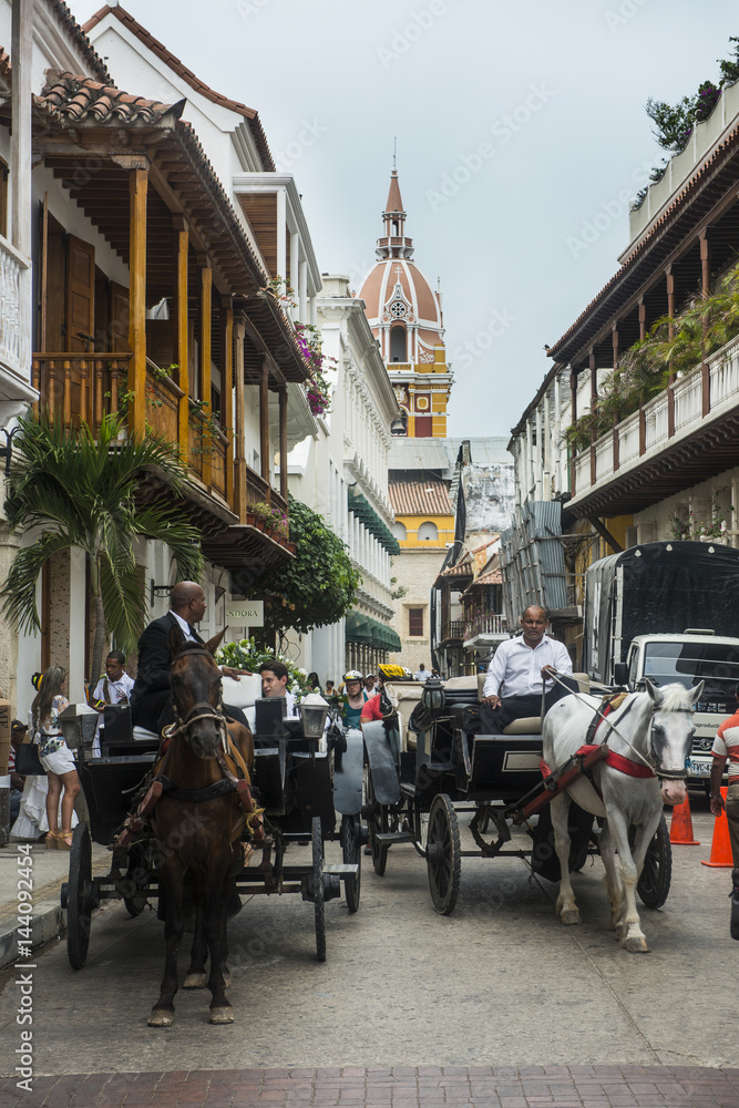 Horse cart with tourists in the old town, Cartagena, Colombia Horse cart with tourists in the old town, Cartagena, Colombia