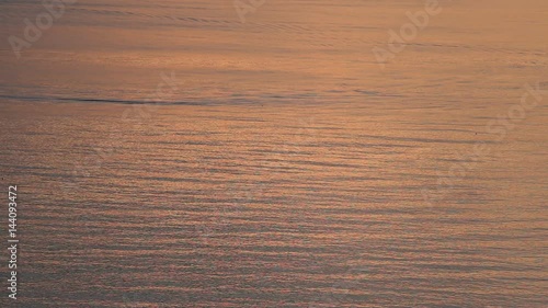 golden and reflect from sunrise on sea texture at dawn 