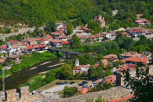 The Church of St. Demetrius and the bishop’s bridge connecting the two banks of the Yantra river is passing between the hills Tsarevets and Trapezitsa in Veliko Tarnovo Bulgaria. photo