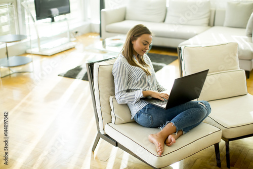 Young woman sitting on the ...