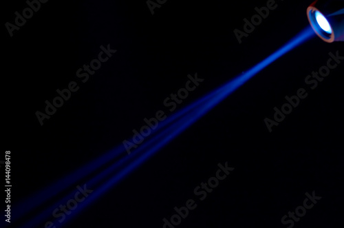 Beam of blue light on black . Applied to a searchlight torch