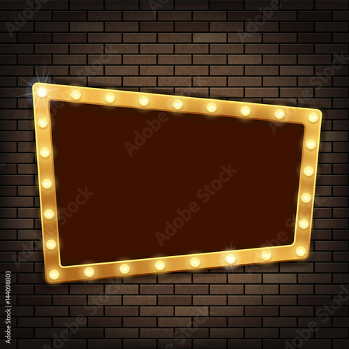 Gold frame with light bulbs on the red brick wall.