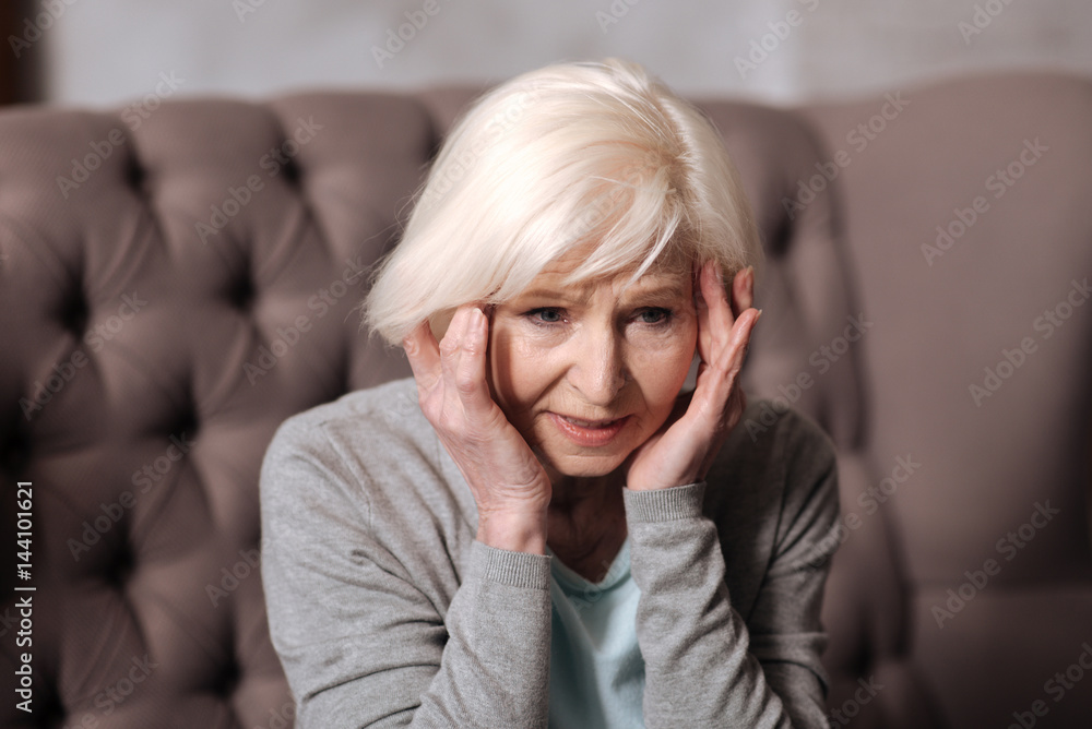 Close up aged woman with headache Close up aged woman with headache