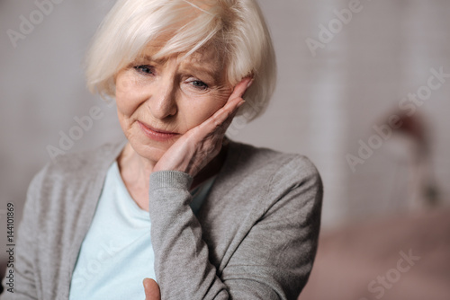 Close up of depressed aged woman