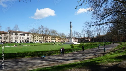 Piazza Ariostea in Ferrara, region of Emilia Romagna, Italy. The area is decorated with a statue of Ludovico Ariosto on a stone column. photo