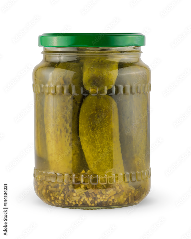Pickles in a glass jar isolated on a white background with clipping path. Package. Pickles in a glass jar isolated on a white background with clipping path. Package.