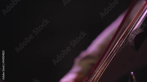 Man playing the cello, close up. photo