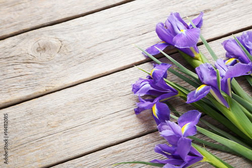 Fototapeta Naklejka Na Ścianę i Meble -  Bouquet of iris flowers on grey wooden table