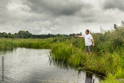 Middle aged man fishing