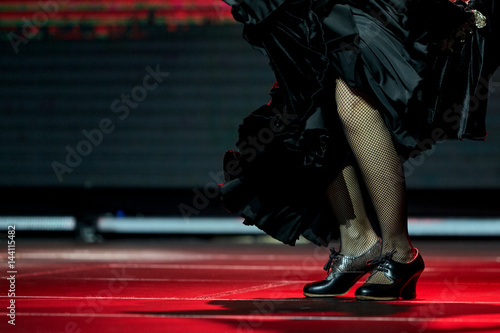 Woman legs dance flamenco black skirt and shoes for print