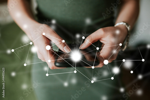 IOT - internet of things concept, woman using a touchscreen smart phone. Data connection concept. Internet of things, future digital technology concept.