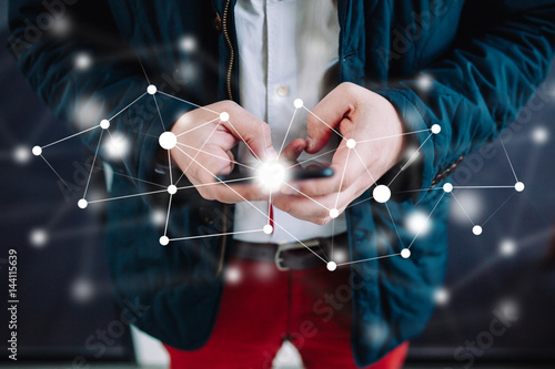 IOT - internet of things concept, man using a touchscreen smart phone. Man using smartphone with white data connection concept. Internet of things, future digital technology concept.