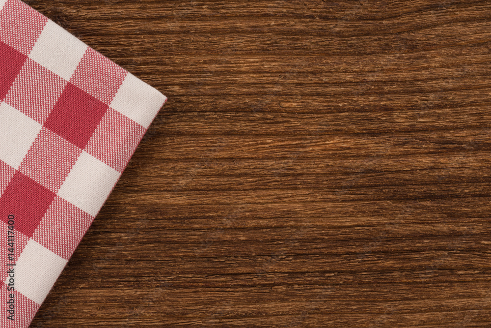 Tablecloth textile on wooden background Tablecloth textile on wooden background