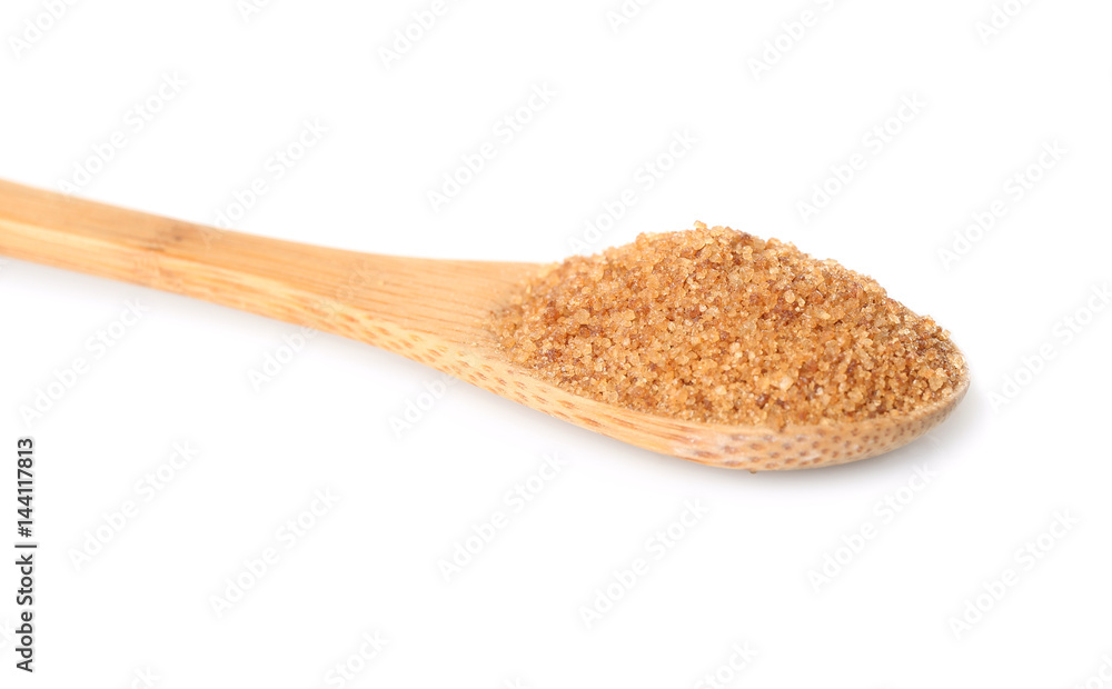 Heap of brown sugar in spoon, isolated on white Heap of brown sugar in spoon, isolated on white