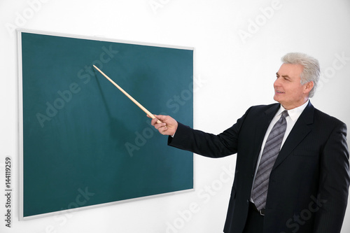 Senior teacher with pointer...