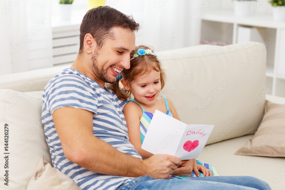 Father's day. Happy family daughter giving dad greeting card Father's day. Happy family daughter giving dad greeting card