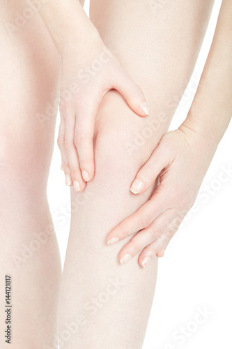 Woman fatigued leg with knee pain isolated on white, clipping path