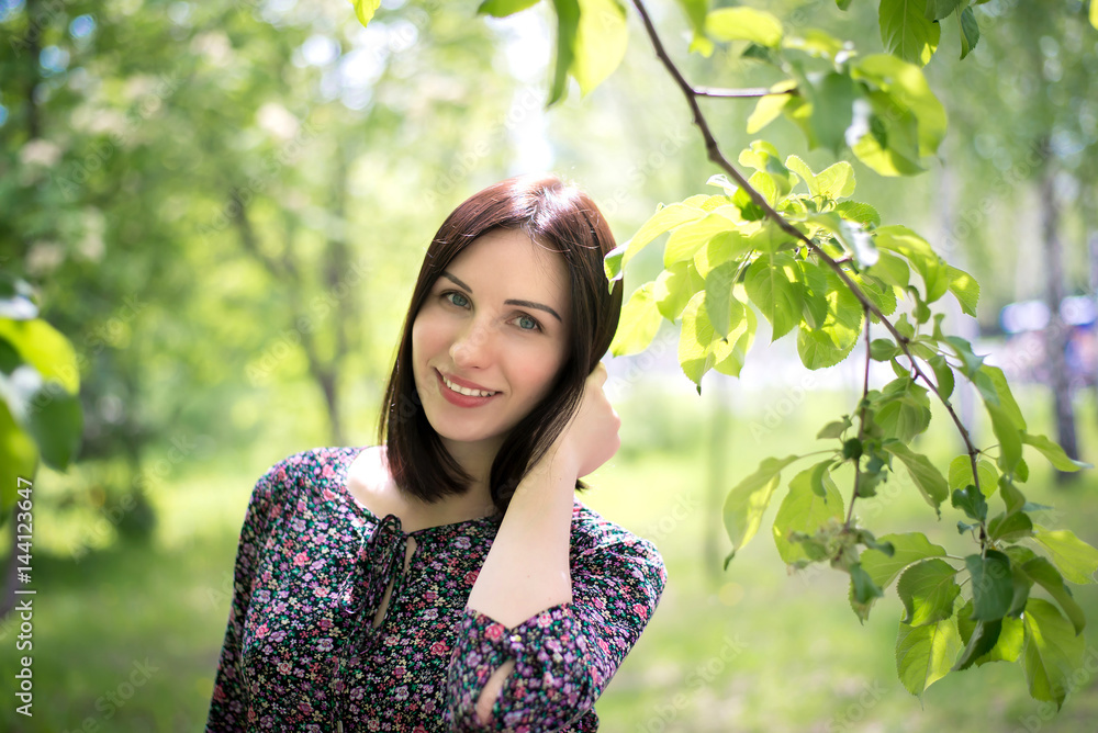 Beautiful girl on background of young foliage Beautiful girl on background of young foliage