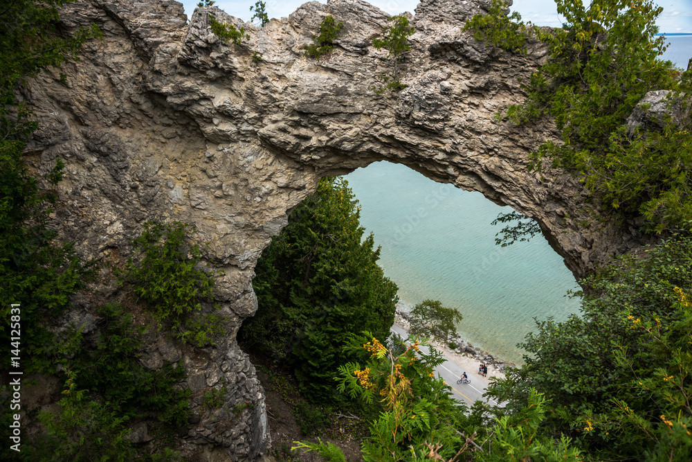 Rock arch with bicyclists