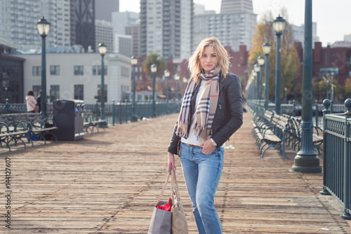 Photography young attractive woman in the city