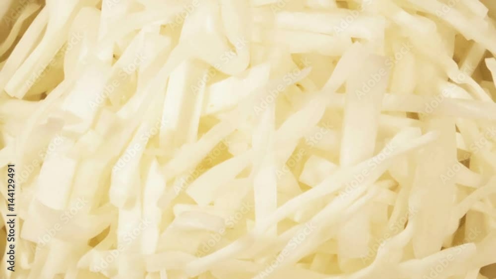 Chopped cabbage in white cup on wooden background close up. Ingredient for vegetable salad Chopped cabbage in white cup on wooden background close up. Ingredient for vegetable salad