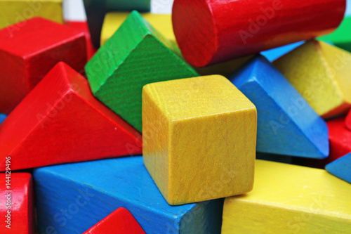Toy blocks. Wooden colorful block wallpaper.