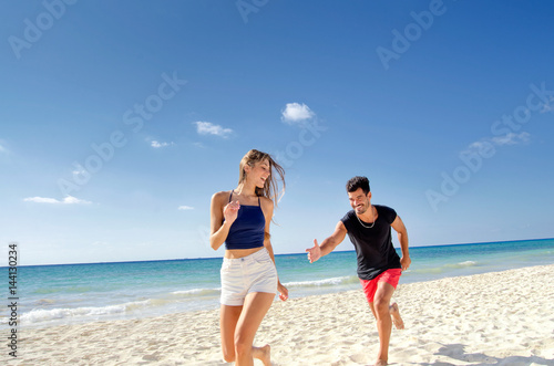 Couple playing on the beach