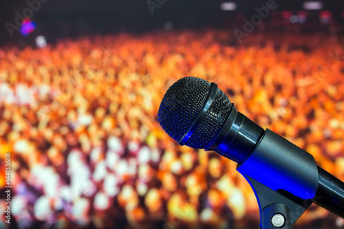 Stage microphone in the background of the crowd